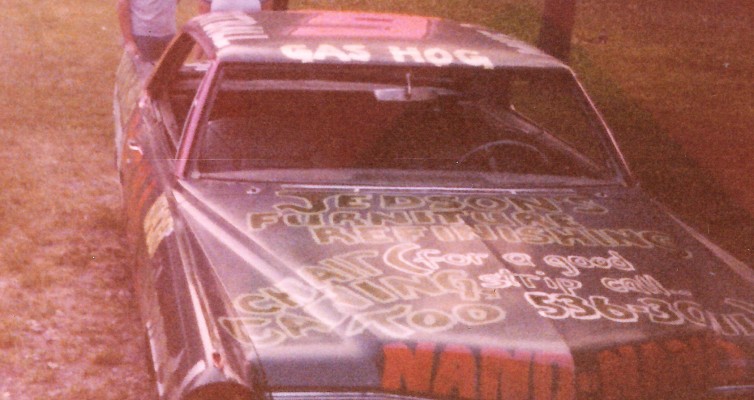 This is me during my teen years seen here with my serious brother and his then girlfriend (now wife) behind their demolition derby car. (sorry, no picture to be found of the red bell bottoms!)