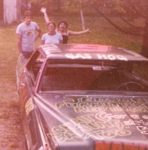 I couldn't find a picture in those red-bell-bottom-hip-huggers but that's me in my teen years behind my serious brother and his then girlfriend (now wife!) with their demolition derby car.